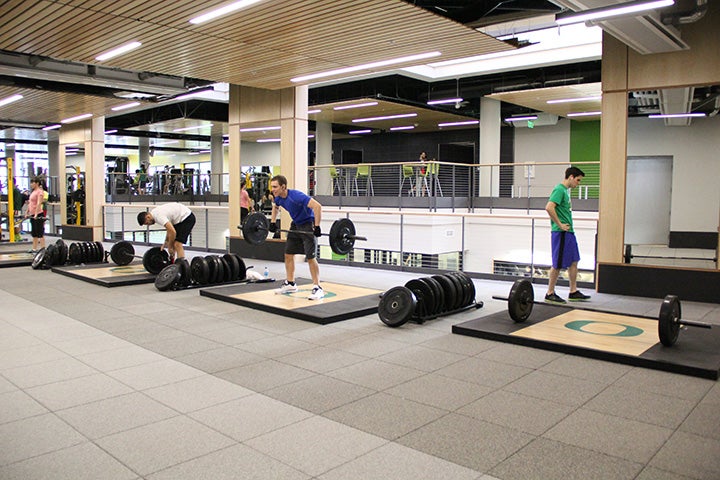 People lifting weights in the Rec Center.