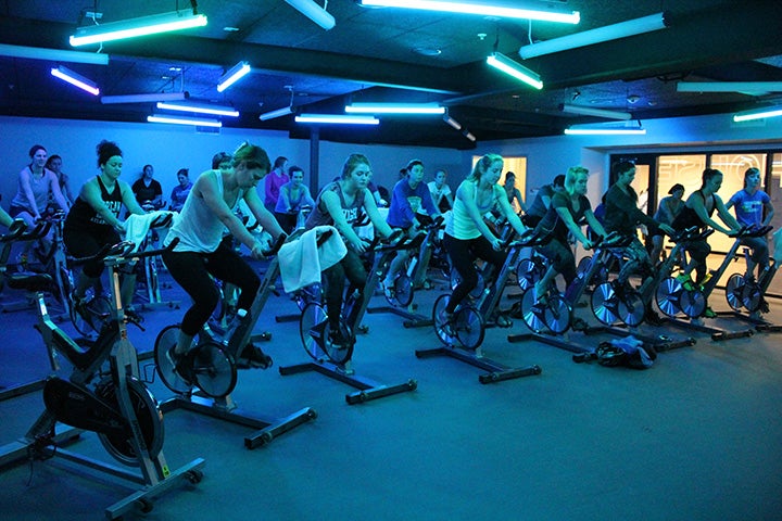 Spin class with special blue lighting.